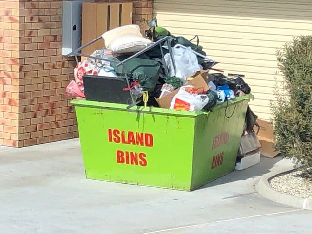 overfilled skip bin in hobart tasmania